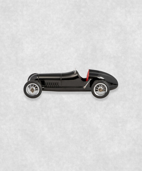 Vintage racing silberfeil car model inspired by classic Grand Prix racers and Silver Arrow legends, featuring a sleek black race car body with a striking red seat. A collectible car model for motorsport and classic car enthusiasts. Viewed from the right side.