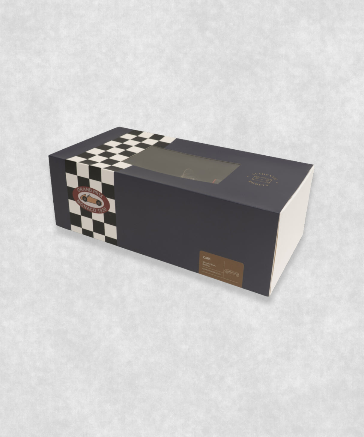 Vintage racing silberfeil car model inspired by classic Grand Prix racers and Silver Arrow legends, featuring a sleek black race car body with a striking red seat. A collectible car model for motorsport and classic car enthusiasts. Viewed from a front and side perspective.