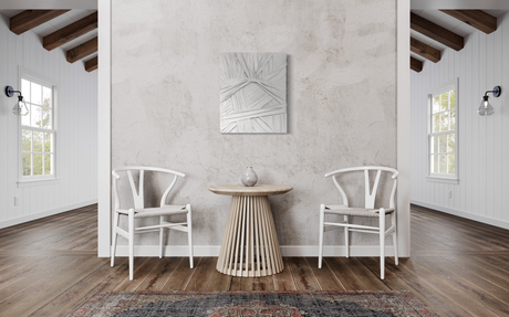 Grey wall sculpture titled "Knot" by Sarah Kvejborg, displayed in a modern interior with light-toned walls and minimalist decor