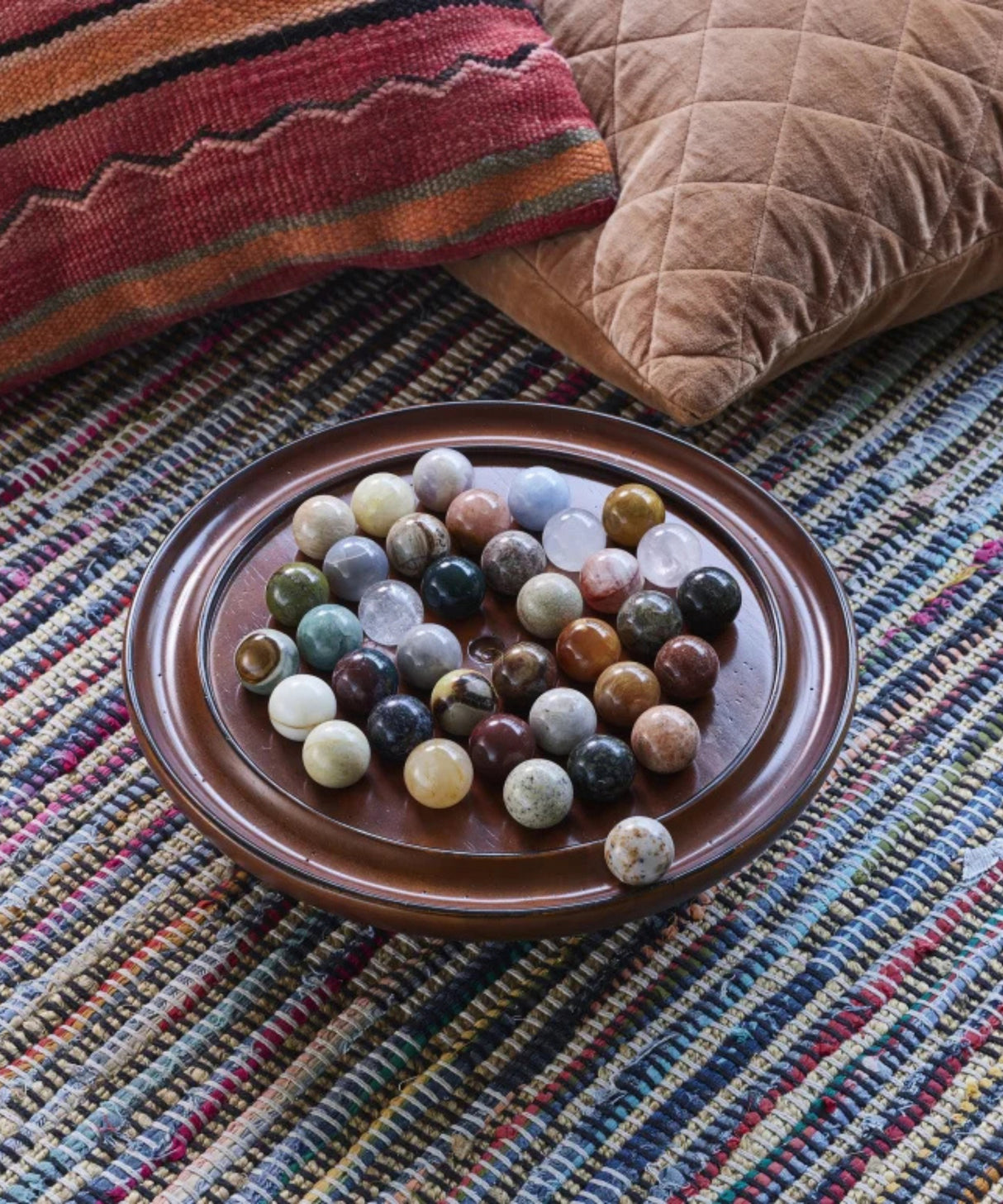 Luxury solitaire game made of precious stones displayed as decorative piece in elegant home interior