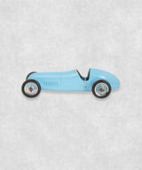 Vintage racing silberfeil car  model inspired by classic Grand Prix racers and Silver Arrow legends, featuring a blue race car body with a striking black seat. A collectible car model for motorsport and classic car enthusiasts. Viewed from  the left side.