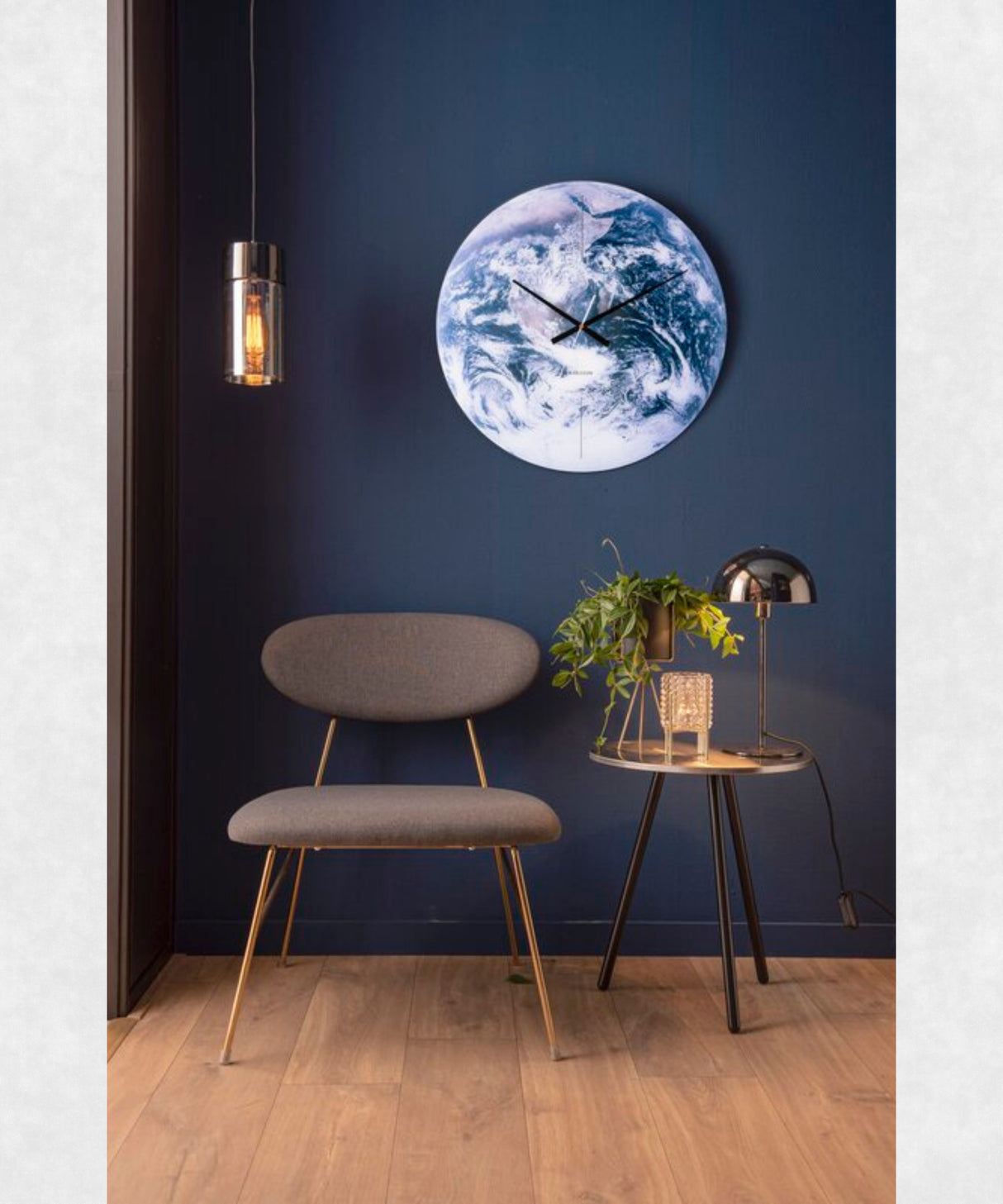 Earth Glass Wall Clock on Wall