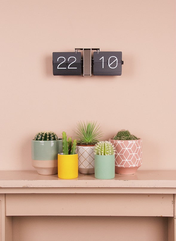 Flip clock Black and Silver on wall