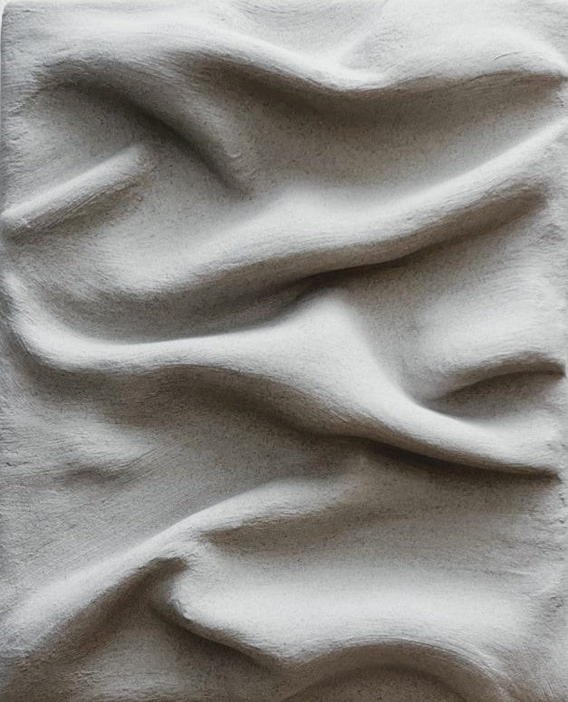 Clay wave-pattern wall art by Sarah Kvejborg 