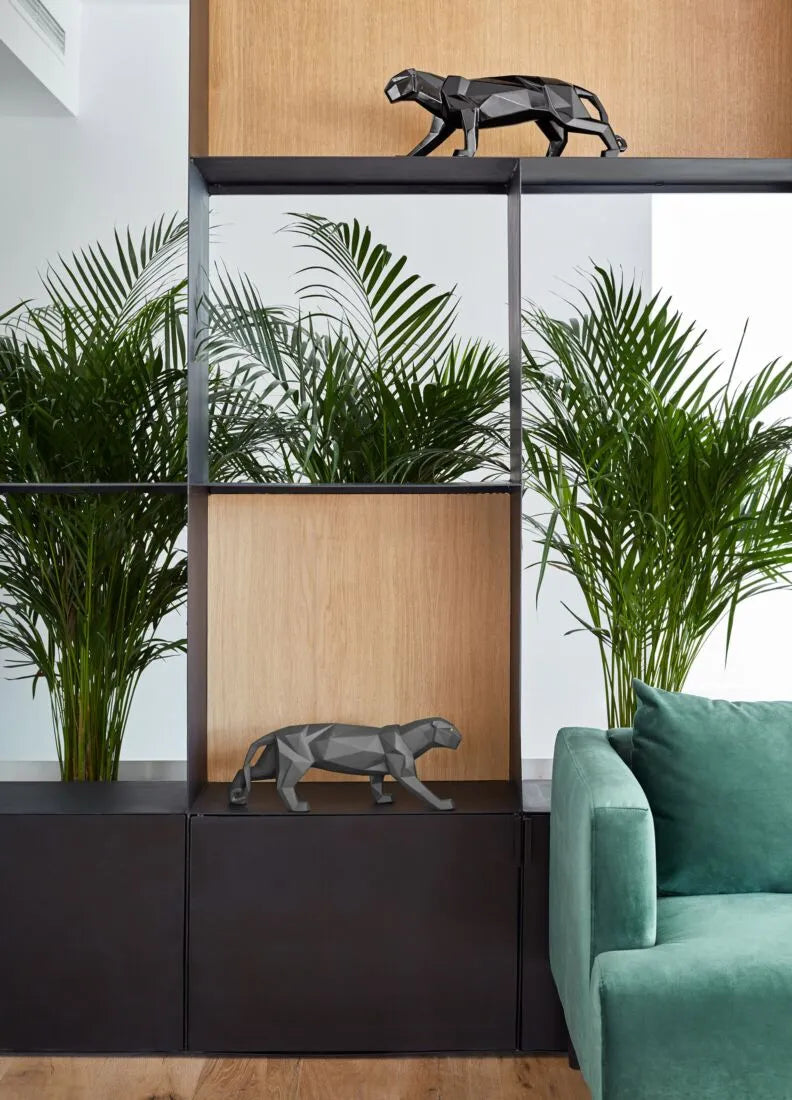 Handcrafted black panther sculpture used as a striking decor piece in a stylish home interior, made in Spain