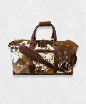 Premium cowhide travel bag in natural leather, front view, perfect for weekend trips